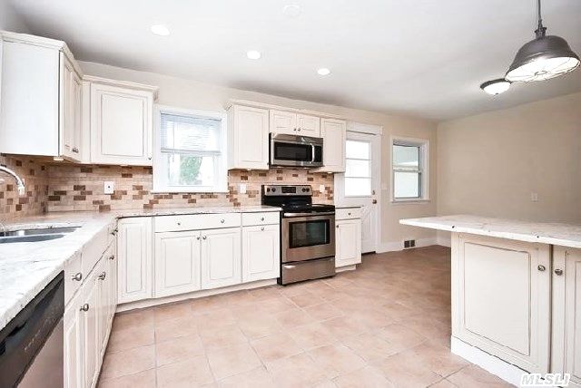 The kitchen of a Riverhead home on the market with an asking price of $300,000.